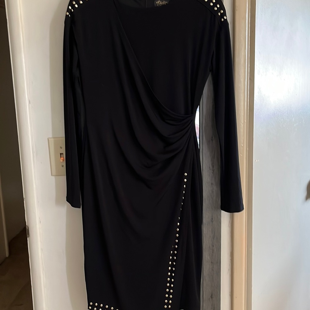 Thalia Sodi size small.. black with gold trim; heavy material